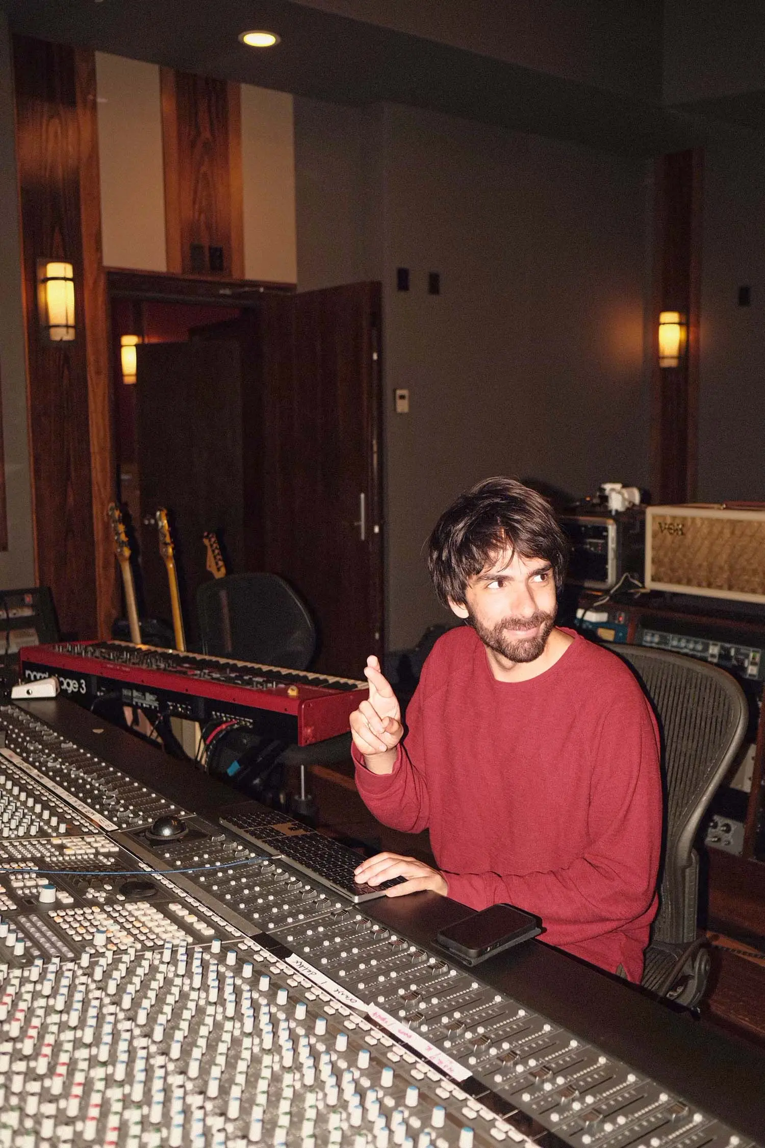 Oliver crossing his fingers in the studio